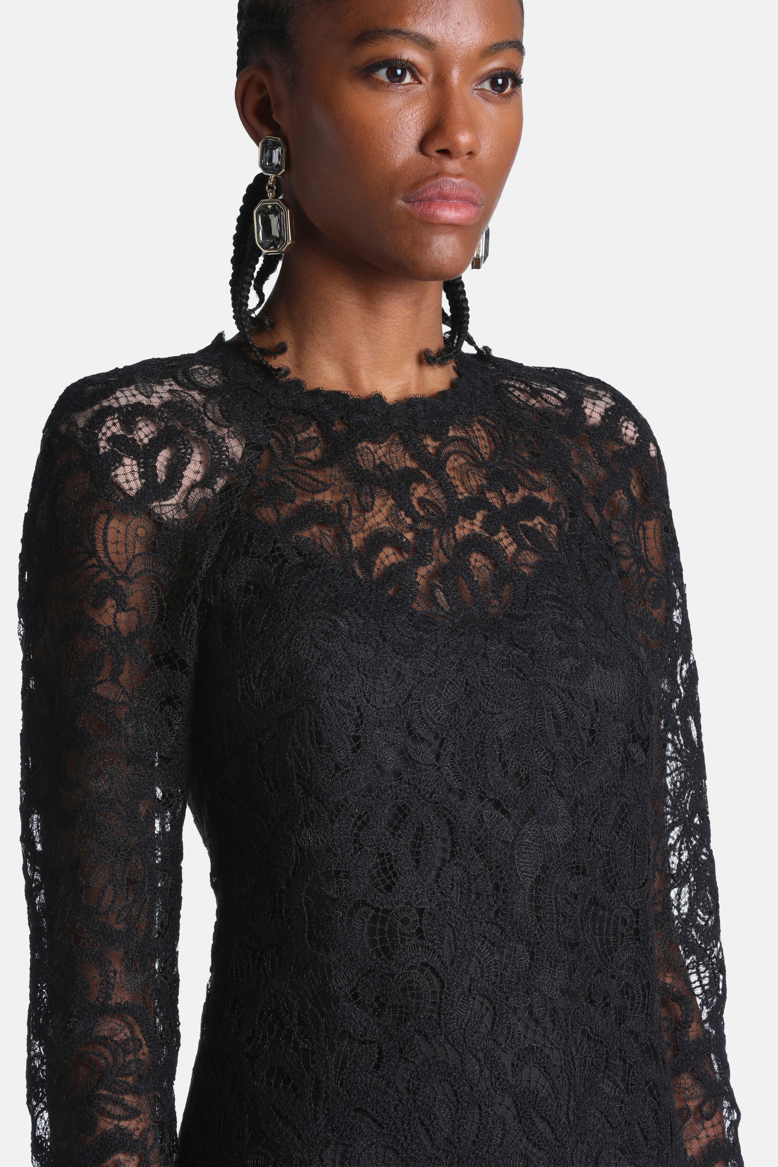 Gardana black lace neckline, sheer sleeves and floral construction in close-up